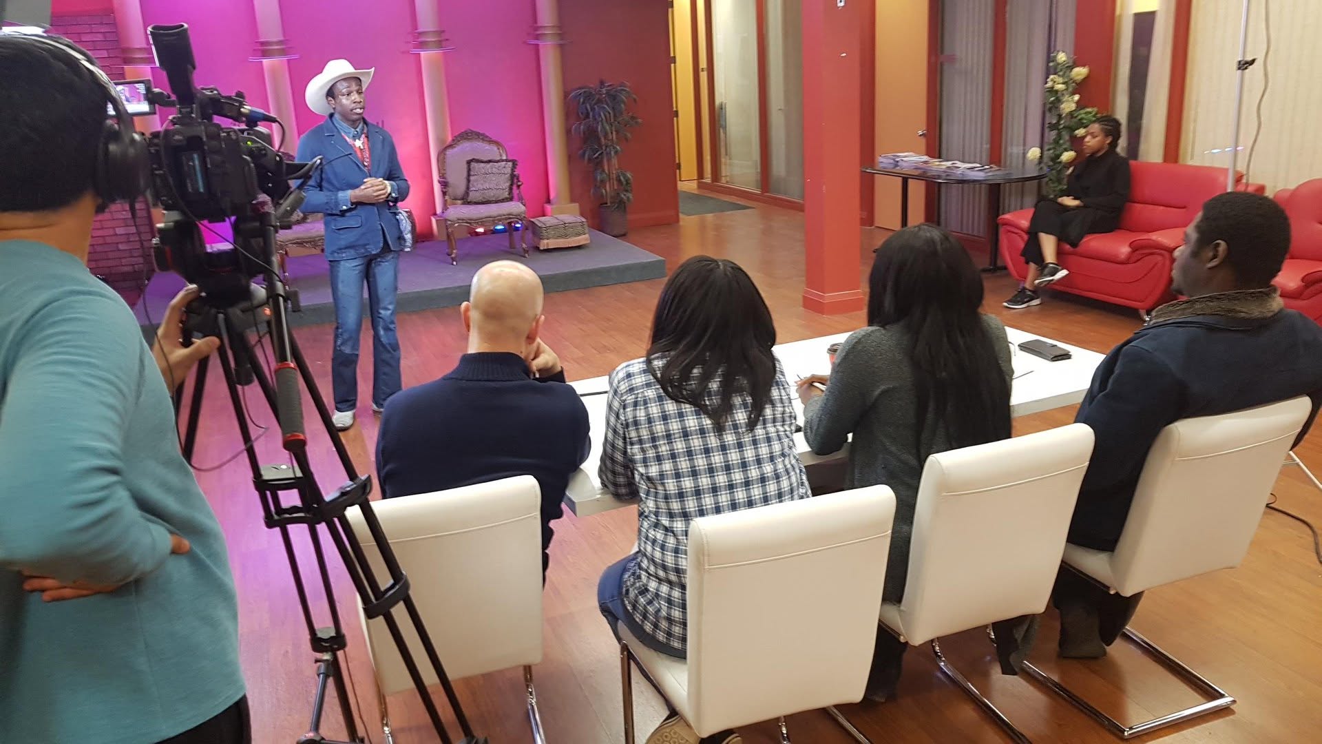 Actor performing in cowboy hat for casting panel